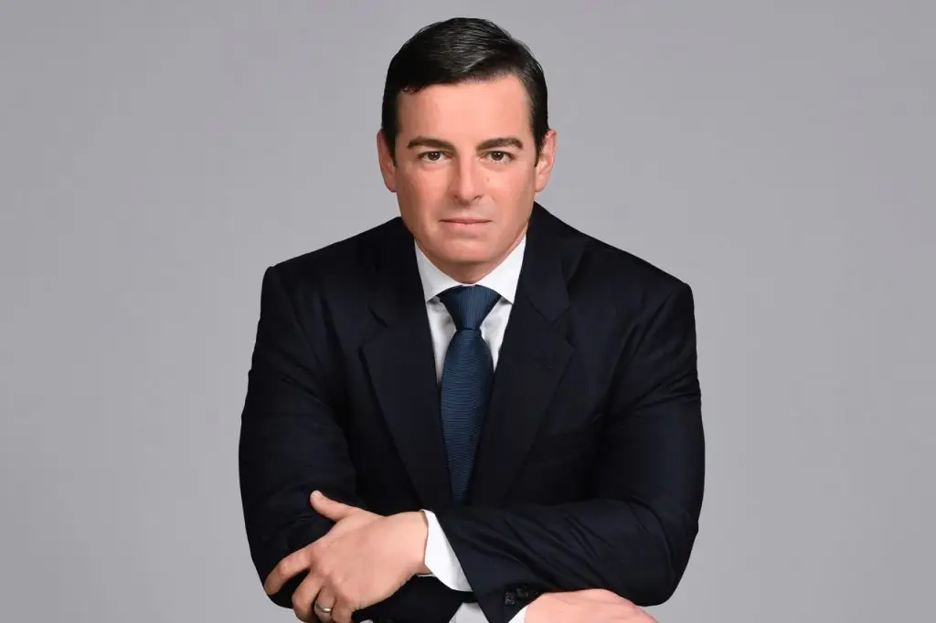 Professional portrait of attorney Michael White, dressed in a dark suit and blue tie, emphasizing his expertise in criminal defense law for clients in Broward County.