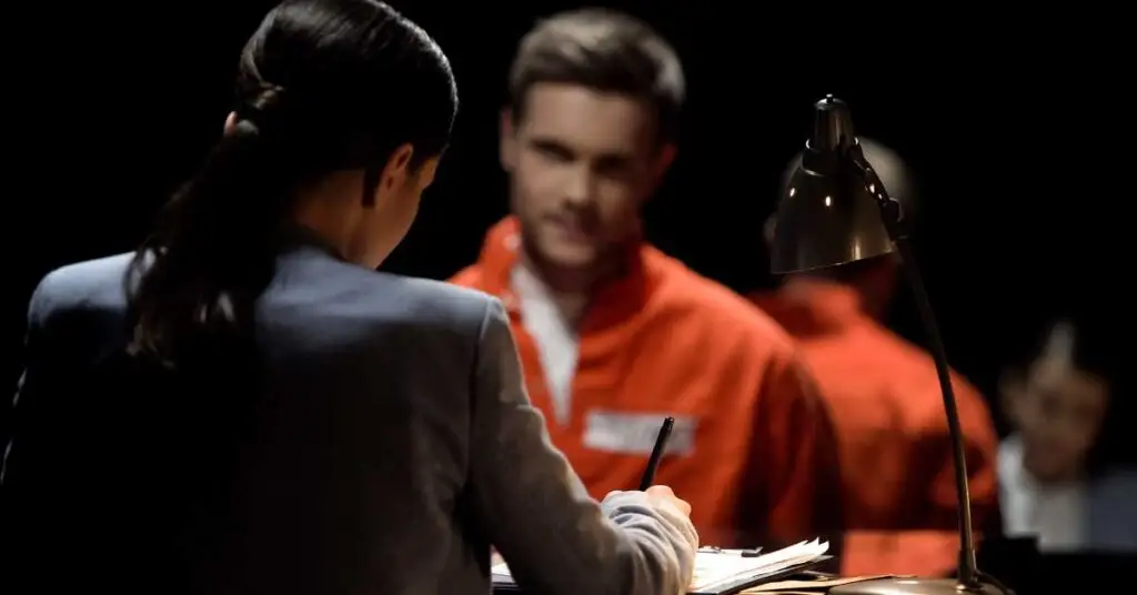 Attorney consulting with a client in a prison setting, focusing on legal representation for firearm-related charges in Florida.