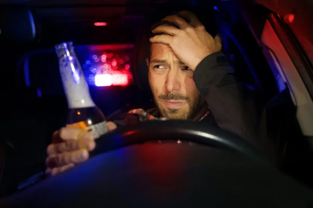 Man pulled over at night during DUI stop in Florida, illustrating how long a DUI stays on your record in Florida