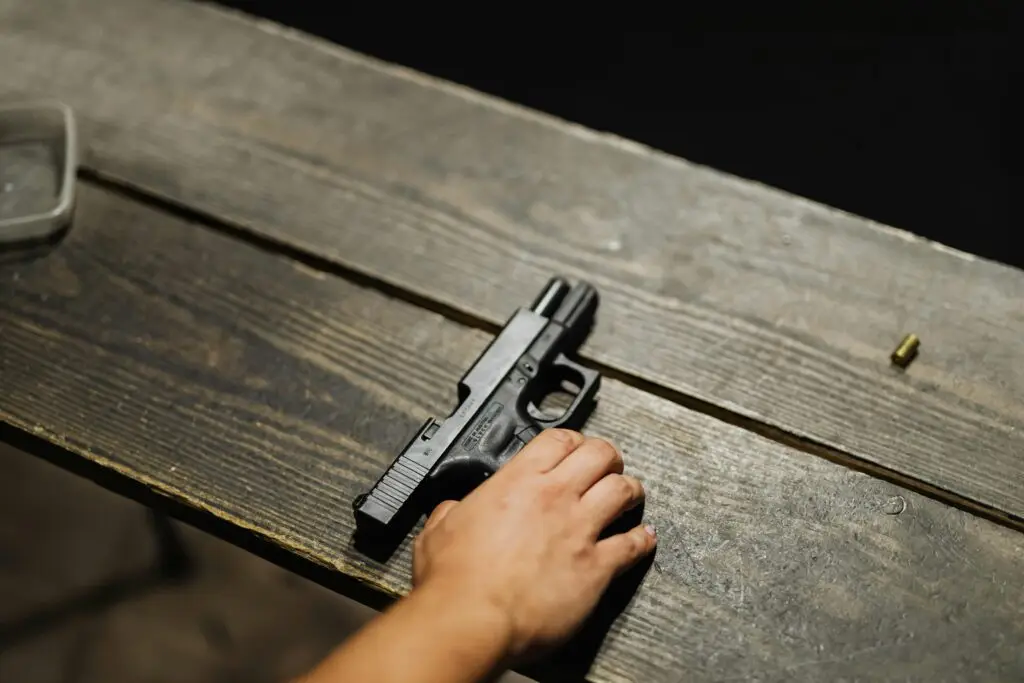 Handgun secured in vehicle glovebox, illustrating Florida gun laws on carrying without a permit