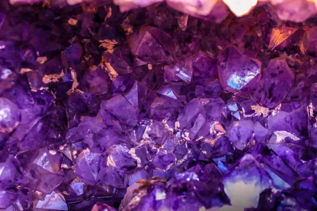 Close-up of purple crystal shards resembling methamphetamine, used to represent felony drug possession in Florida.